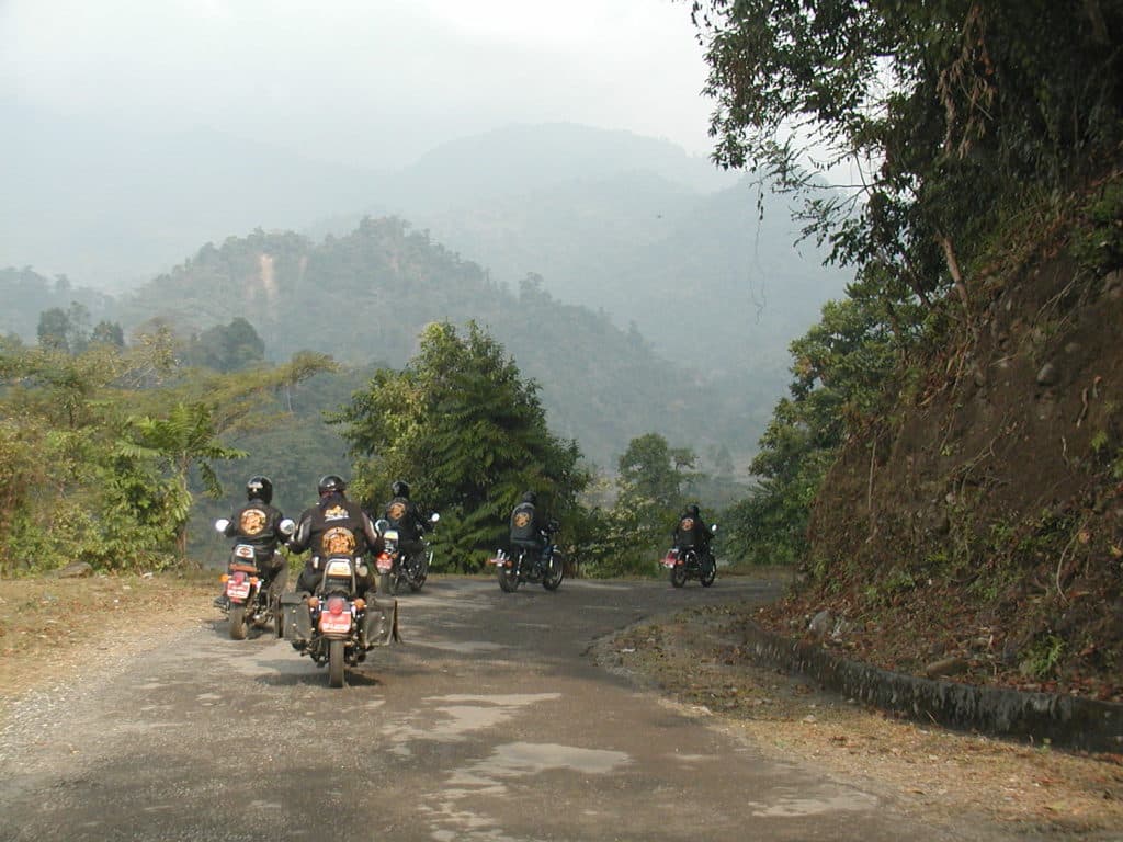 The Tarayana Dragons Motorcycle Club riding through the mountains of Bhutan