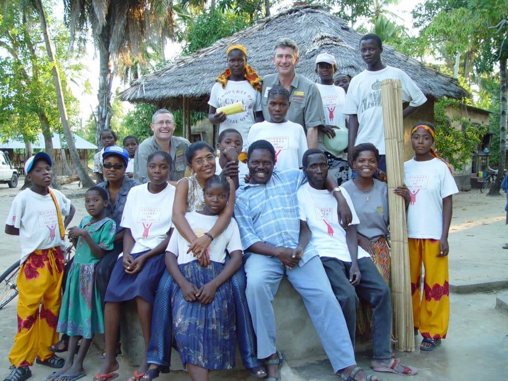James Irving With the 'Save The Children' crew & villagers in Quelimane, Mozambique