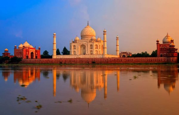 The Taj Mahal is an ivory-white marble mausoleum on the right bank of the river Yamuna in Agra